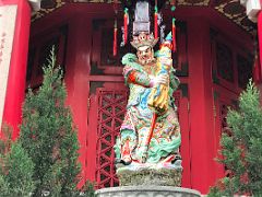 11A Statue of the chief of the four heavenly kings and protector of the north holds an umbrella Yue Heung Shrine at Wong Tai Sin temple Hong Kong